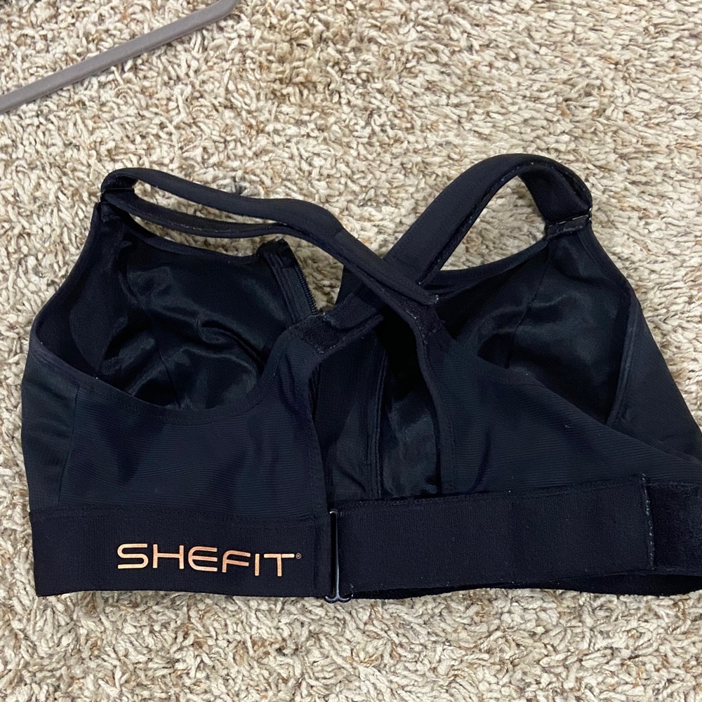 SHEFIT Black Adjustable High-Impact Sports Bra with Rose Gold Logo 2 Luxe